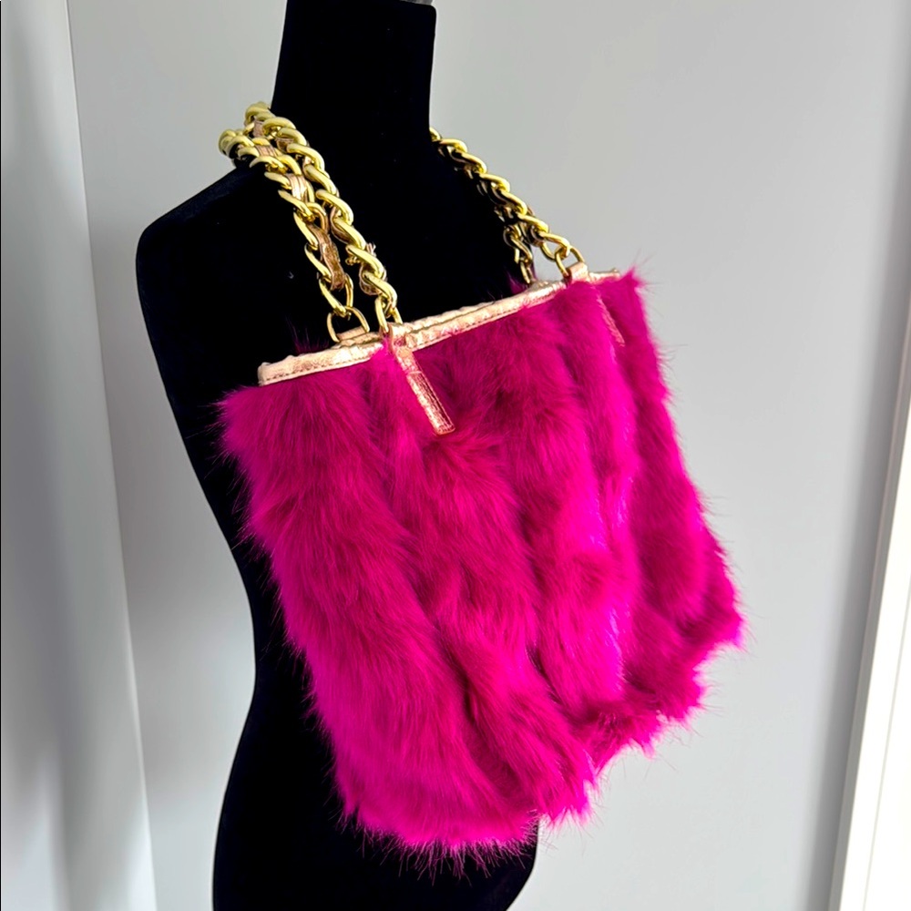 Betsey Johnson pink fur chain strap handbag.